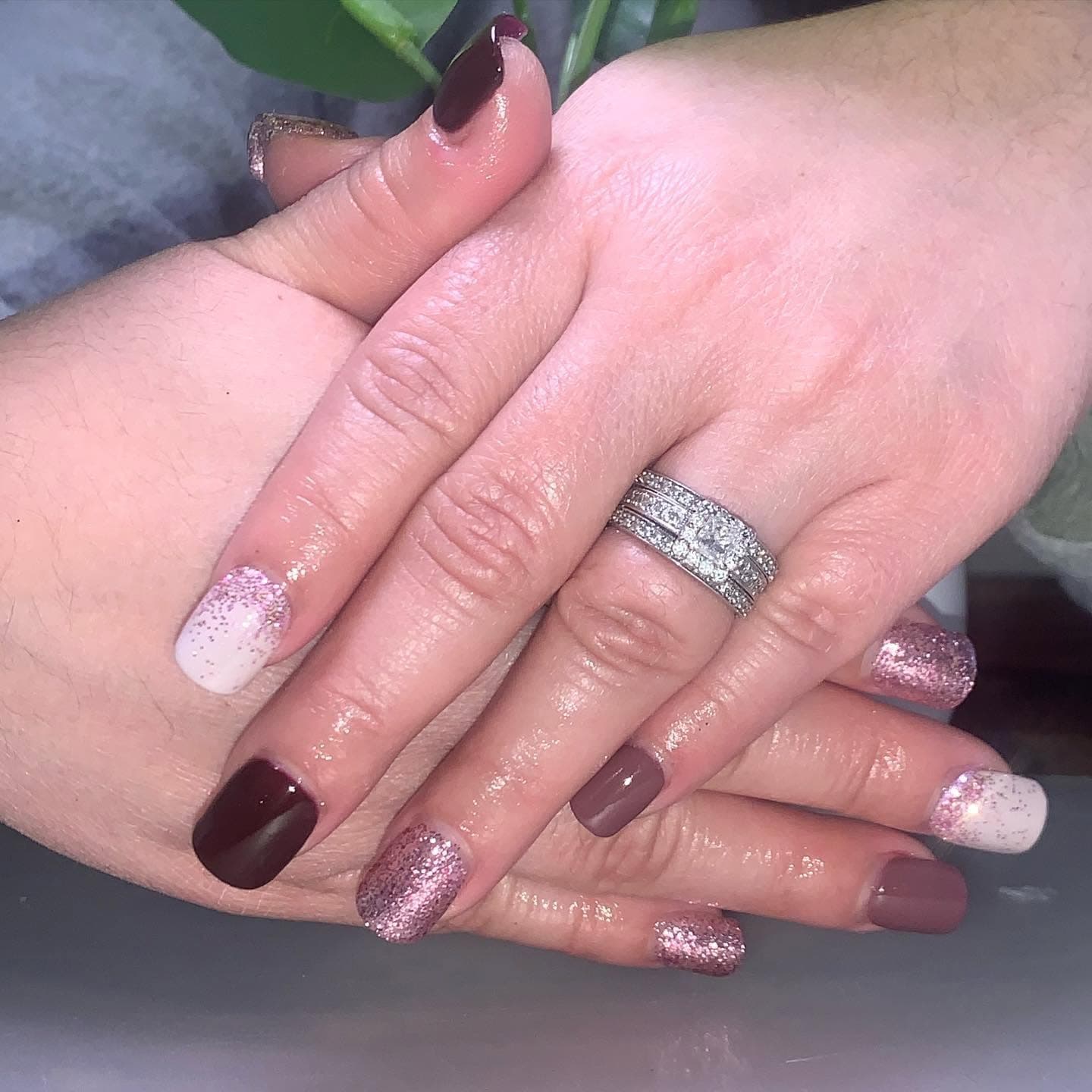 Burgundy, rose-gold glitter, and nude manicure