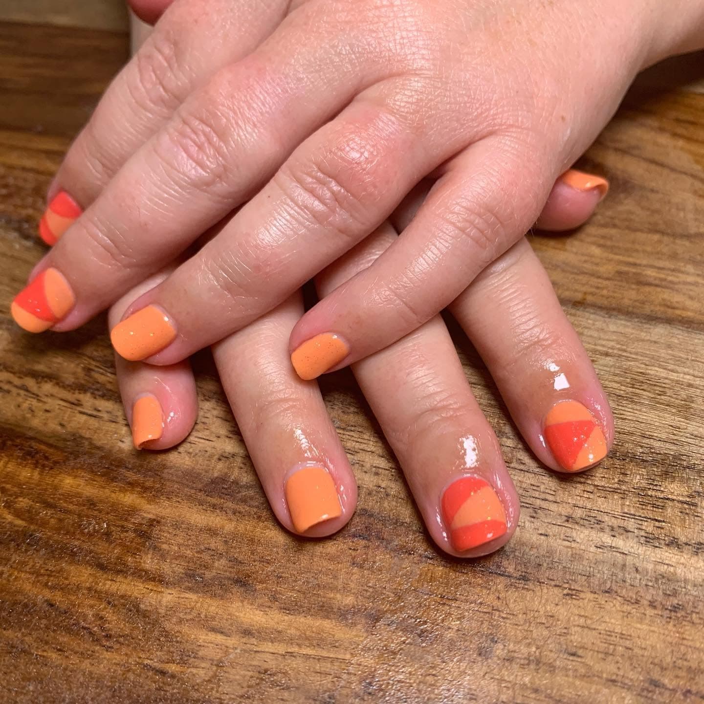 Orange and coral colorblock manicure